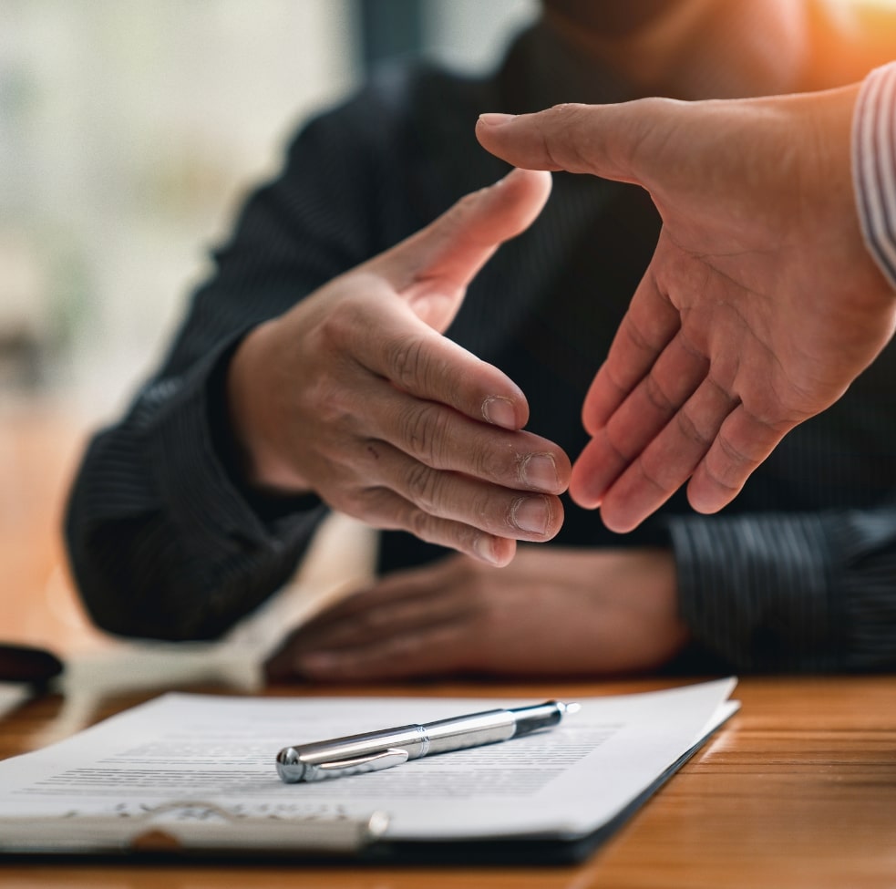 client and lawyer hand shaking